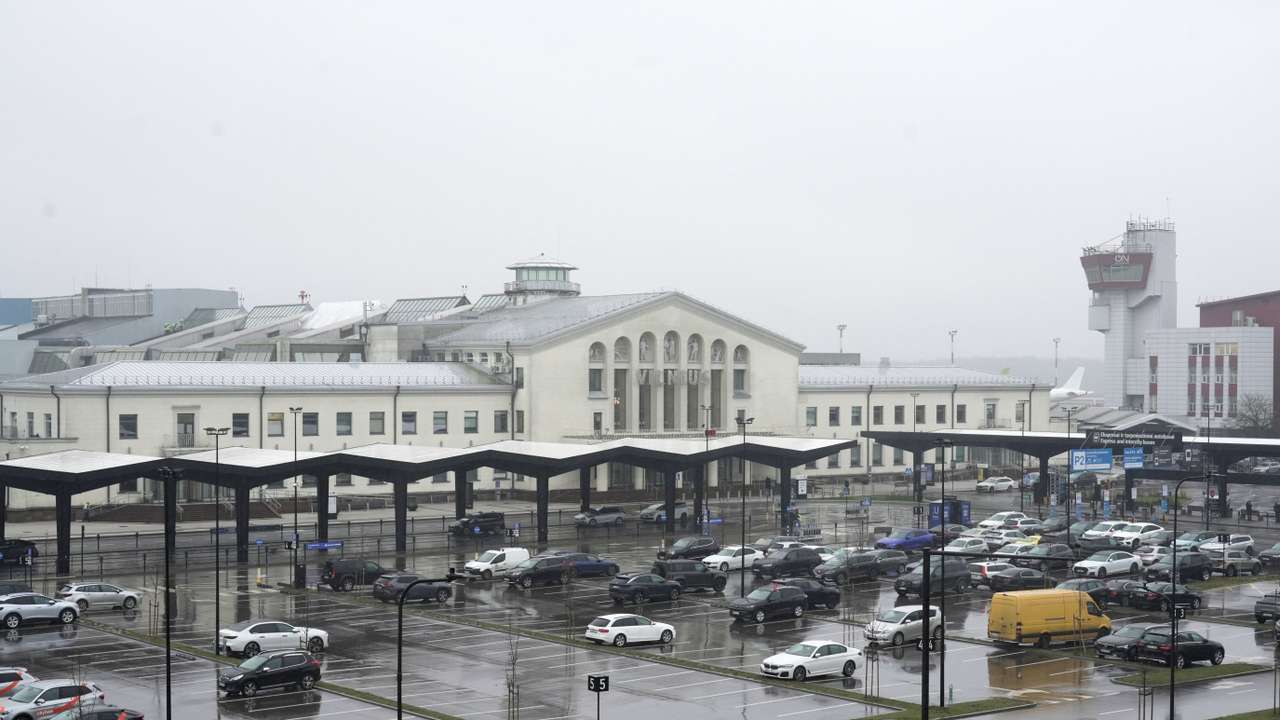 Cars wait in front of the arrival terminal at Vilnius Ciurlionis International Airport in Vilnius