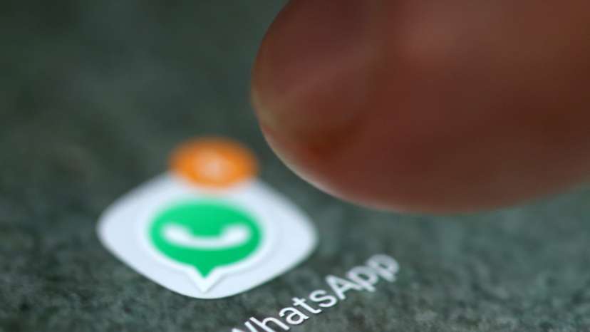 The WhatsApp app logo is seen on a smartphone in this illustration