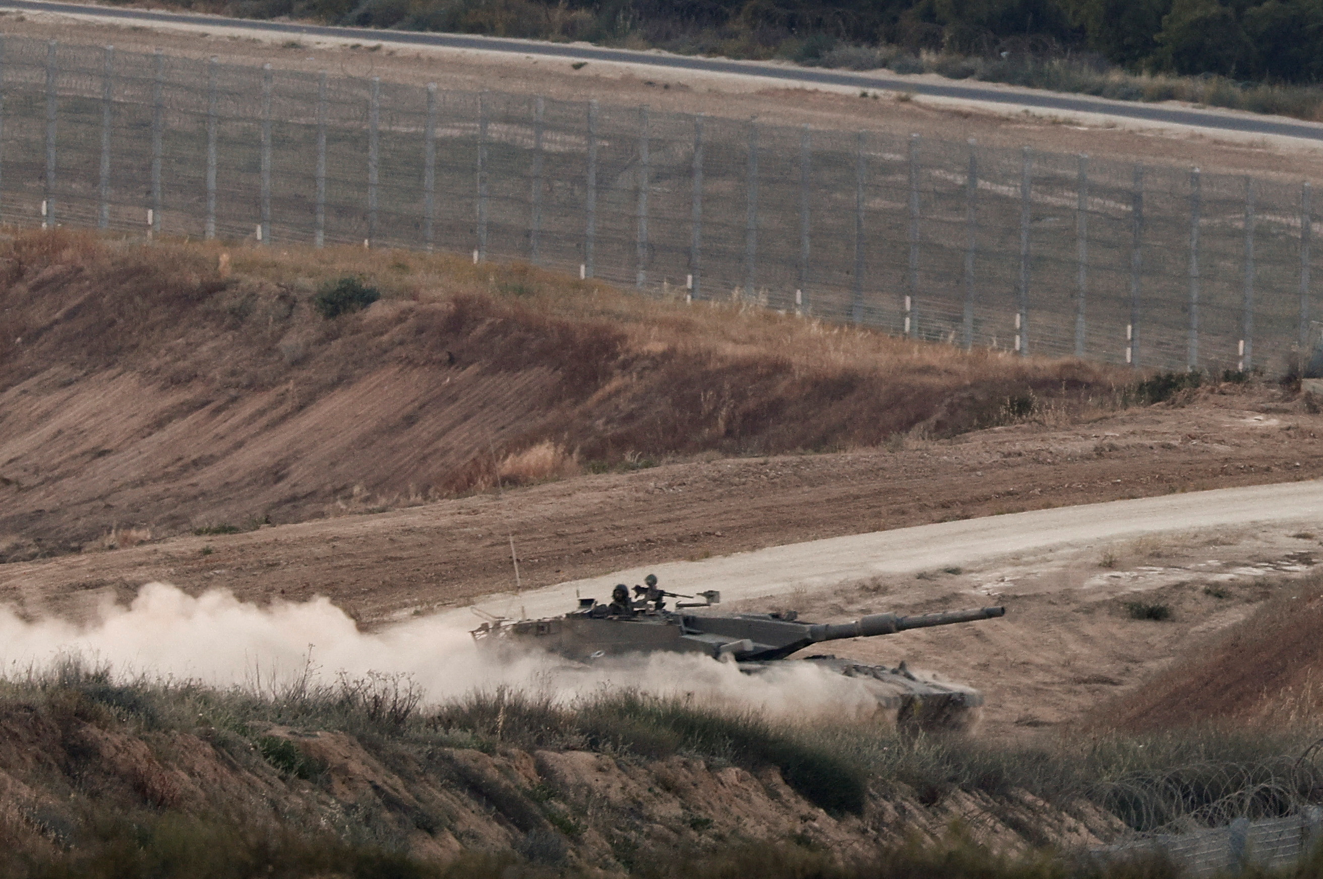 An Israeli tank manoeuvres in Gaza as seen from the Israeli side of the border