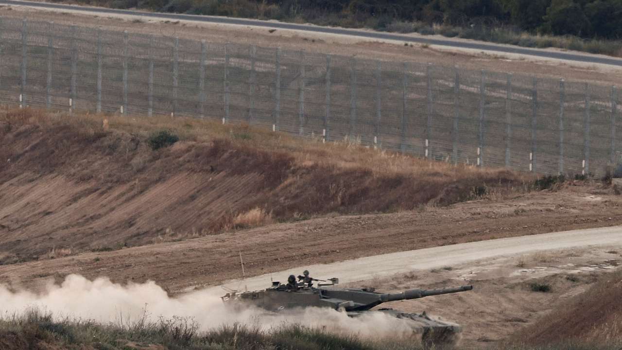 An Israeli tank manoeuvres in Gaza as seen from the Israeli side of the border