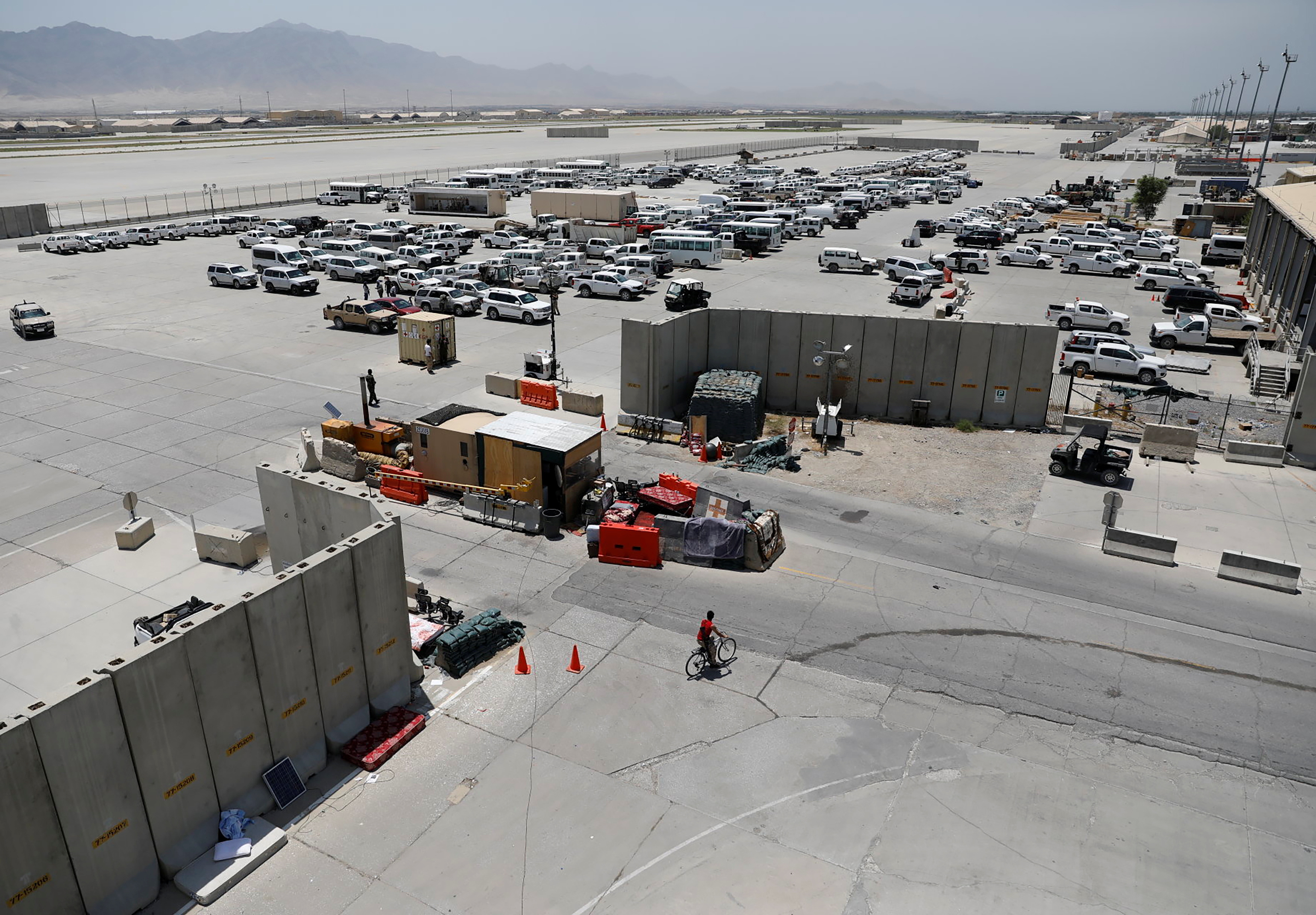 Parked vehicles are seen in Bagram U.S. air base, after American troops vacated it, in Parwan province