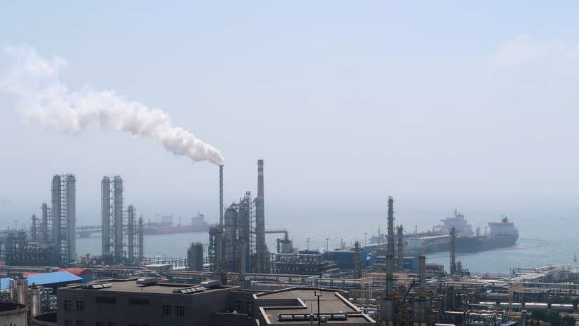 FILE PHOTO: China National Petroleum Corporation (CNPC)'s Dalian Petrochemical Corp refinery is seen near the downtown of Dalian