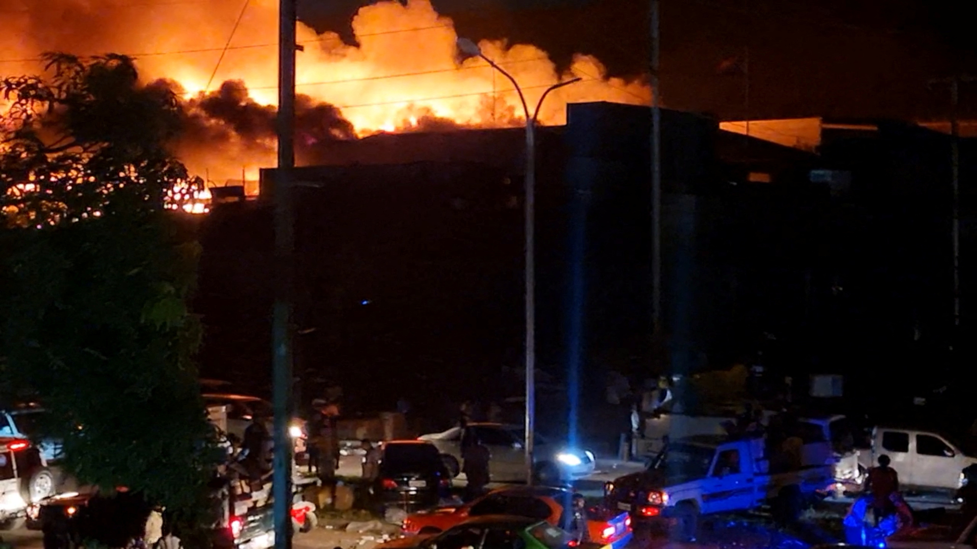 People take part in looting and arson amid protests over a pay cut for police that officials blamed on an administrative glitch, in Port Moresby