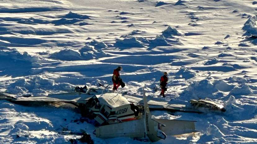 Authorities inspect the wreckage of the Cessna 208B Grand Caravan aircraft operated by Berring Air, near Nome