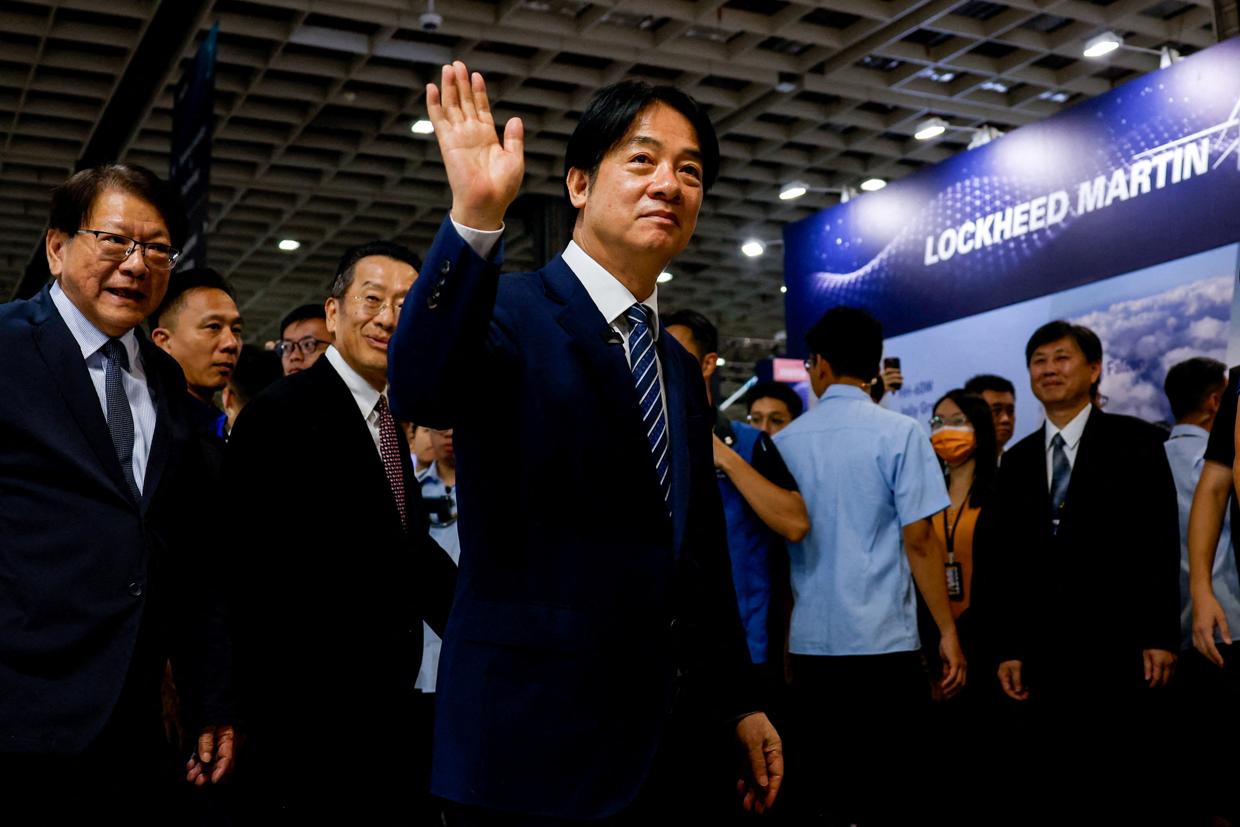 FILE PHOTO: Taiwan's President Lai Ching-te waves as he visits the Taipei Aerospace and Defence Technology Exhibition in Taipei