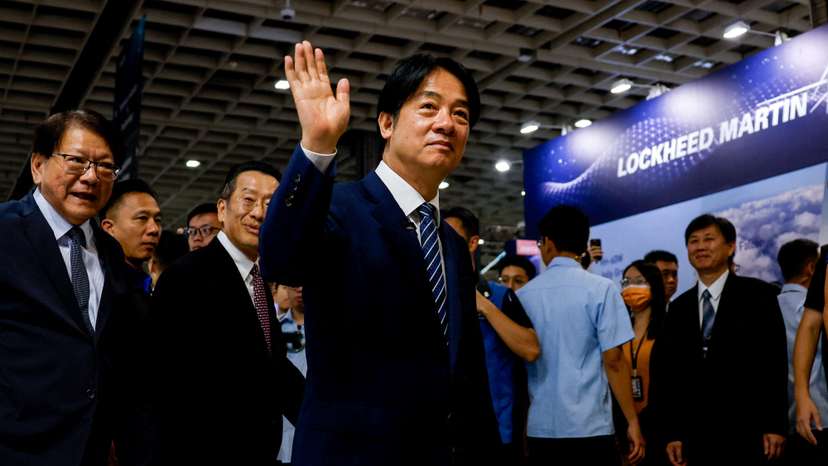 FILE PHOTO: Taiwan's President Lai Ching-te waves as he visits the Taipei Aerospace and Defence Technology Exhibition in Taipei