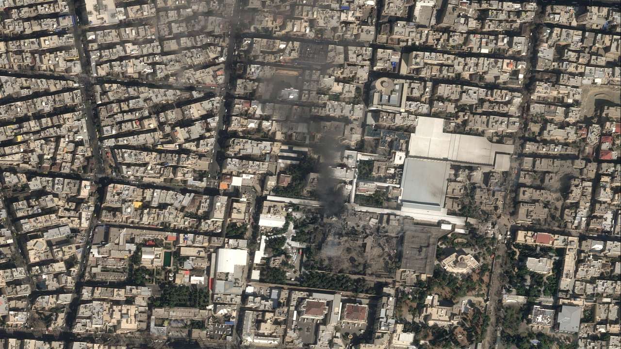 A satellite image shows black smoke rising and heavy damage at Iranian Supreme Leader Ayatollah Ali Khamenei's compound in Tehran