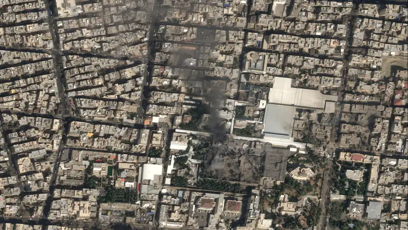 A satellite image shows black smoke rising and heavy damage at Iranian Supreme Leader Ayatollah Ali Khamenei's compound in Tehran