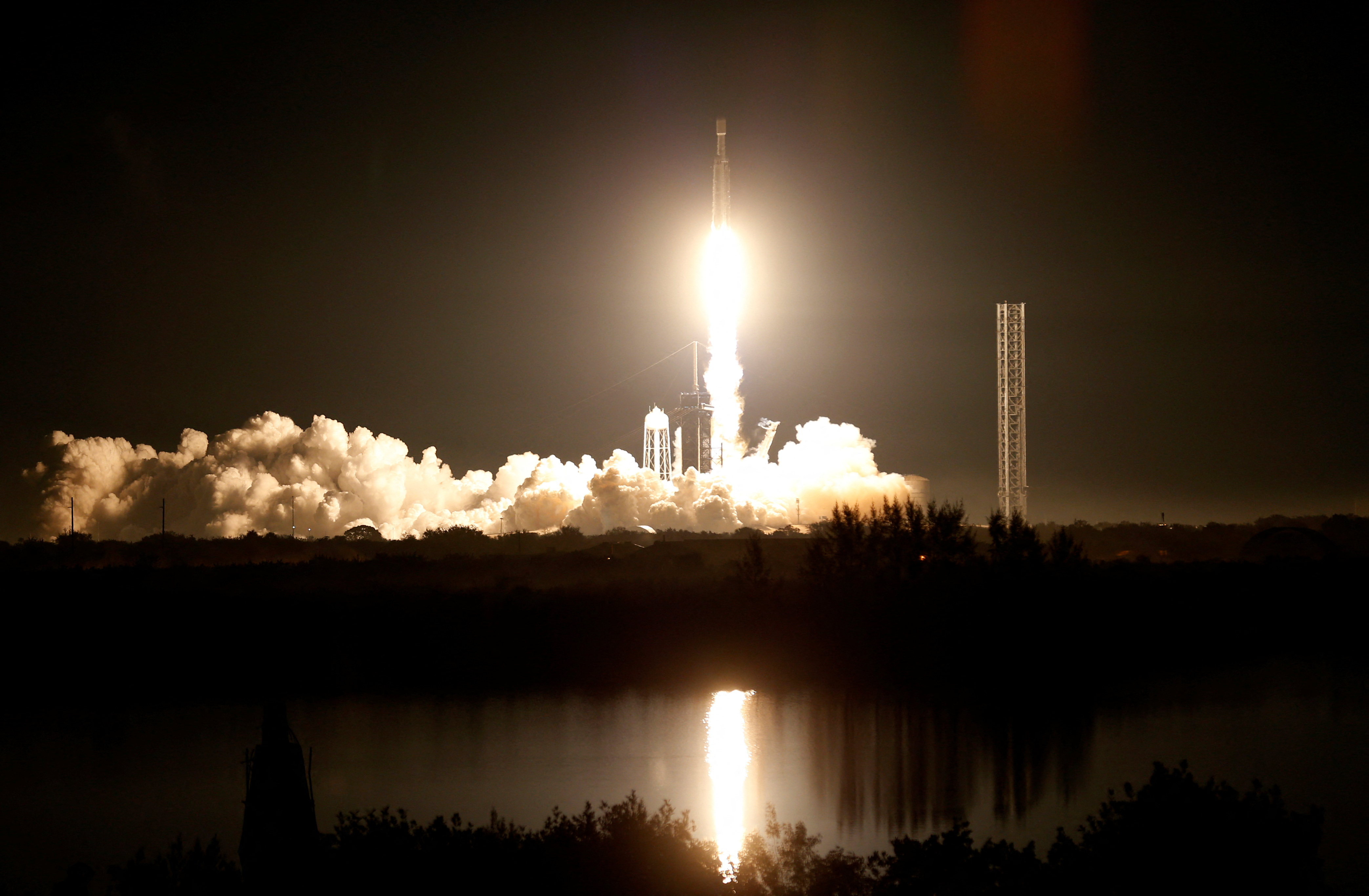 The U.S. military's secretive X-37B robot spaceplane lifts off atop a SpaceX Falcon Heavy rocket