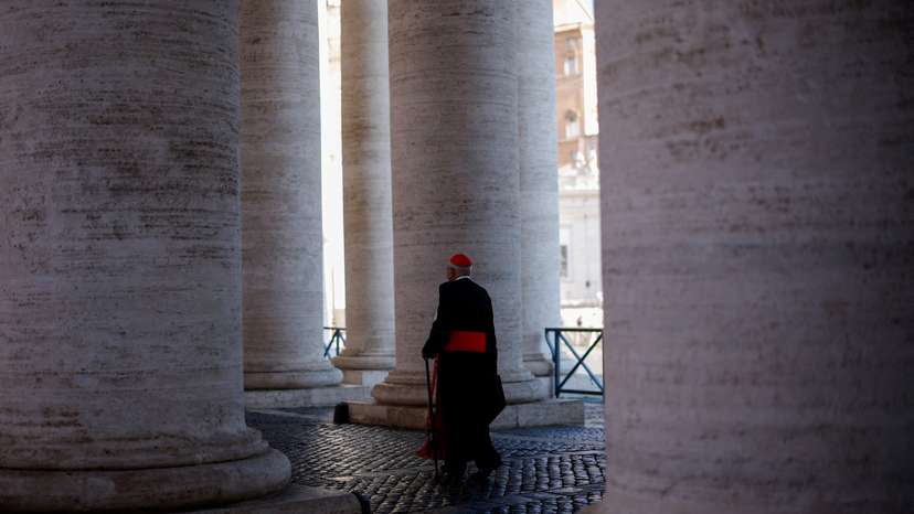 A cardinal walks in St. Peter's Square ahead of the conclave which will be held on May 7, at the Vatican