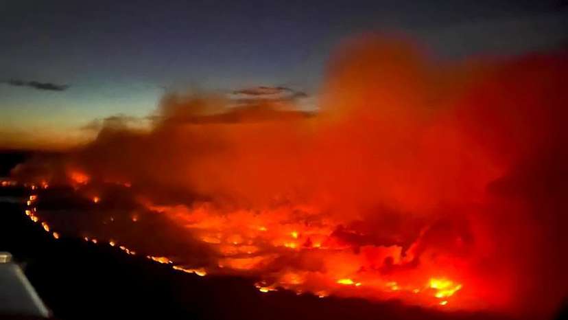The Parker Lake wildfire glows in an aerial photograph taken by a B.C. Emergency Health Services crew member