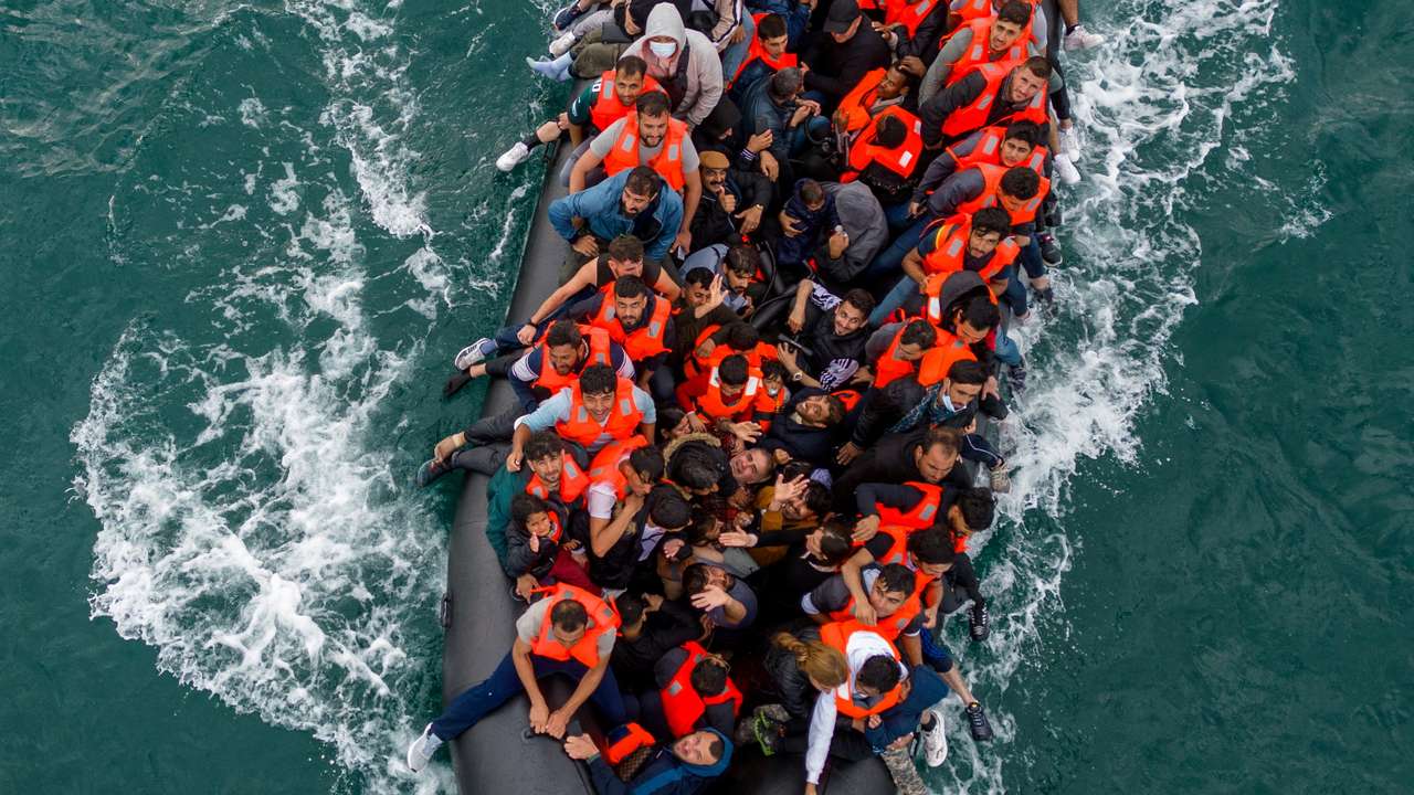 FILE PHOTO: Migrants cross the English Channel in small boats