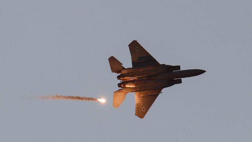 An Israeli military convoy manoeuvres in Gaza, as seen from Israel