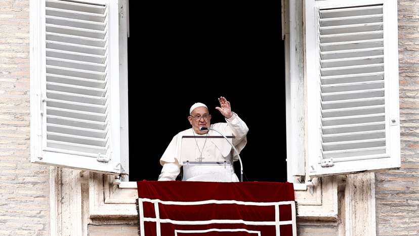 Pope Francis leads the Angelus prayer from his window at the Vatican