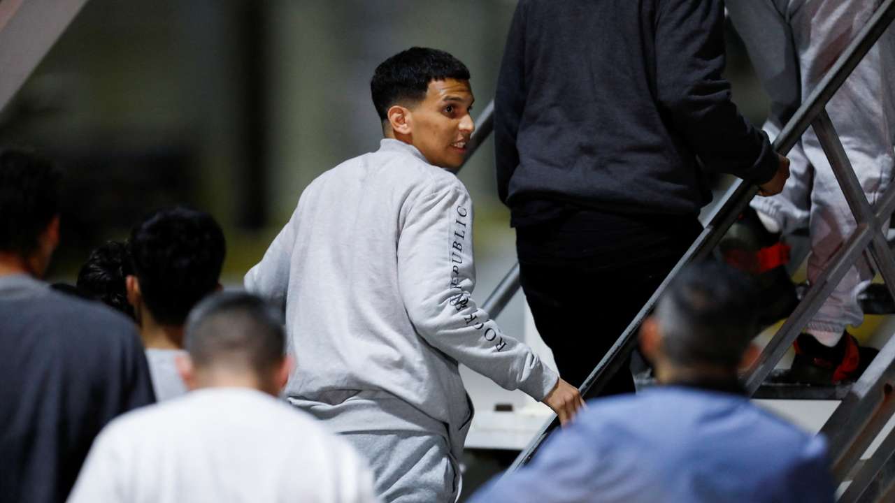 Venezuelan migrants arrive on a flight after being deported from the United States, in Caracas