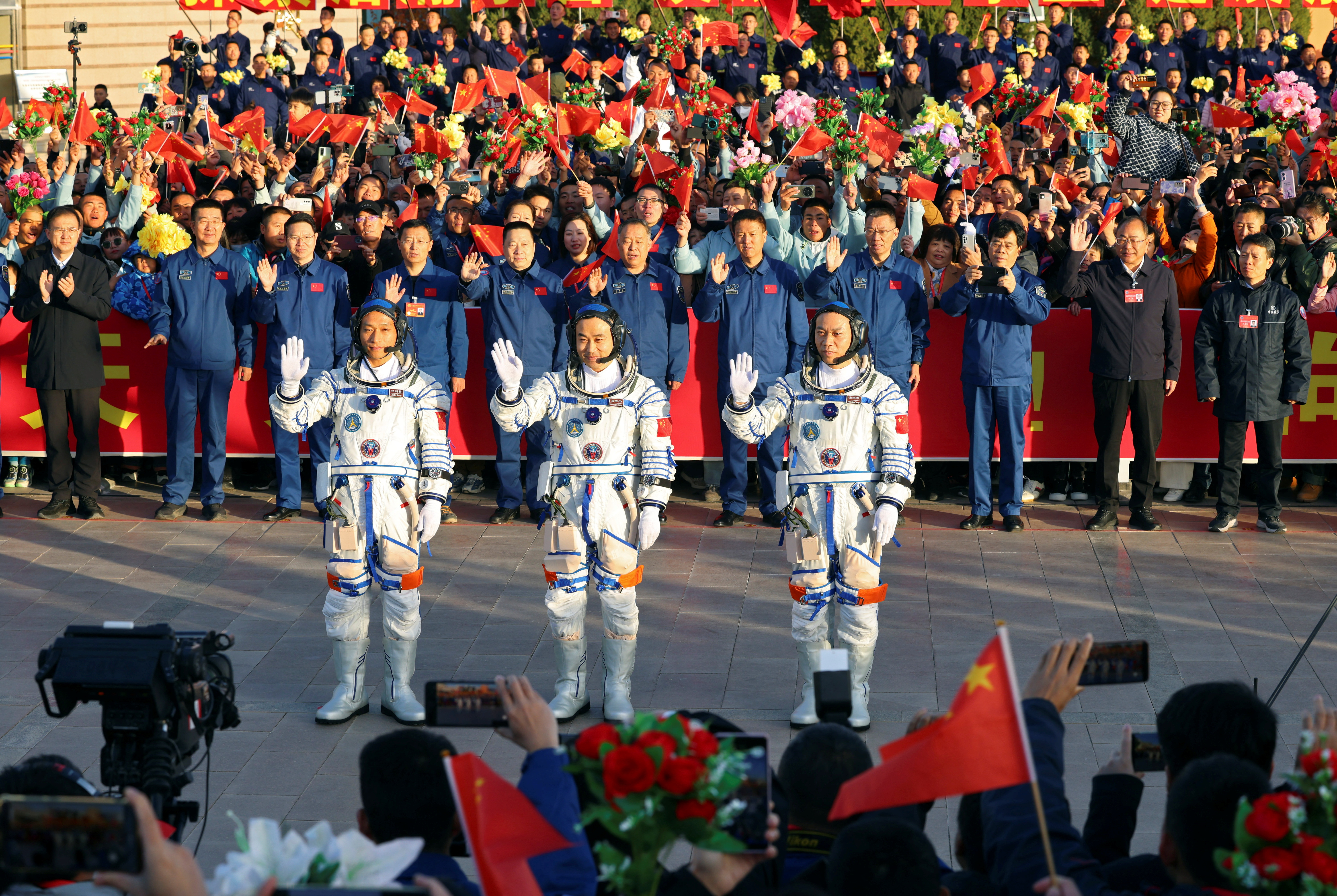 Chinese astronauts Tang Hongbo, Tang Shengjie and Jiang Xinlin of Shenzhou-17 mission attend a ceremony at Jiuquan Satellite Launch Center