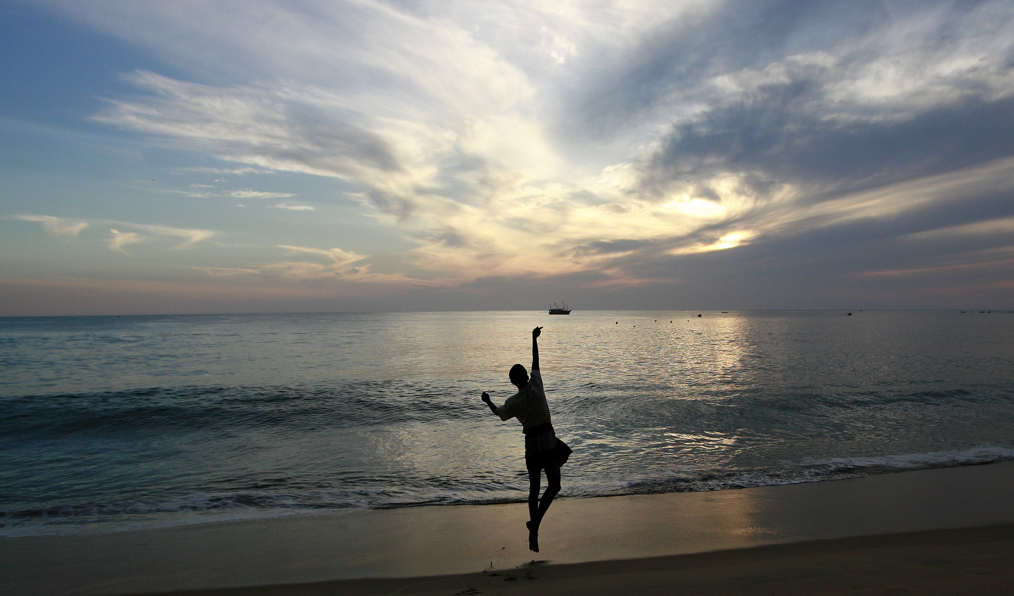 A fisherman throws his line in the morning in Arugam Bay, east of Colombo