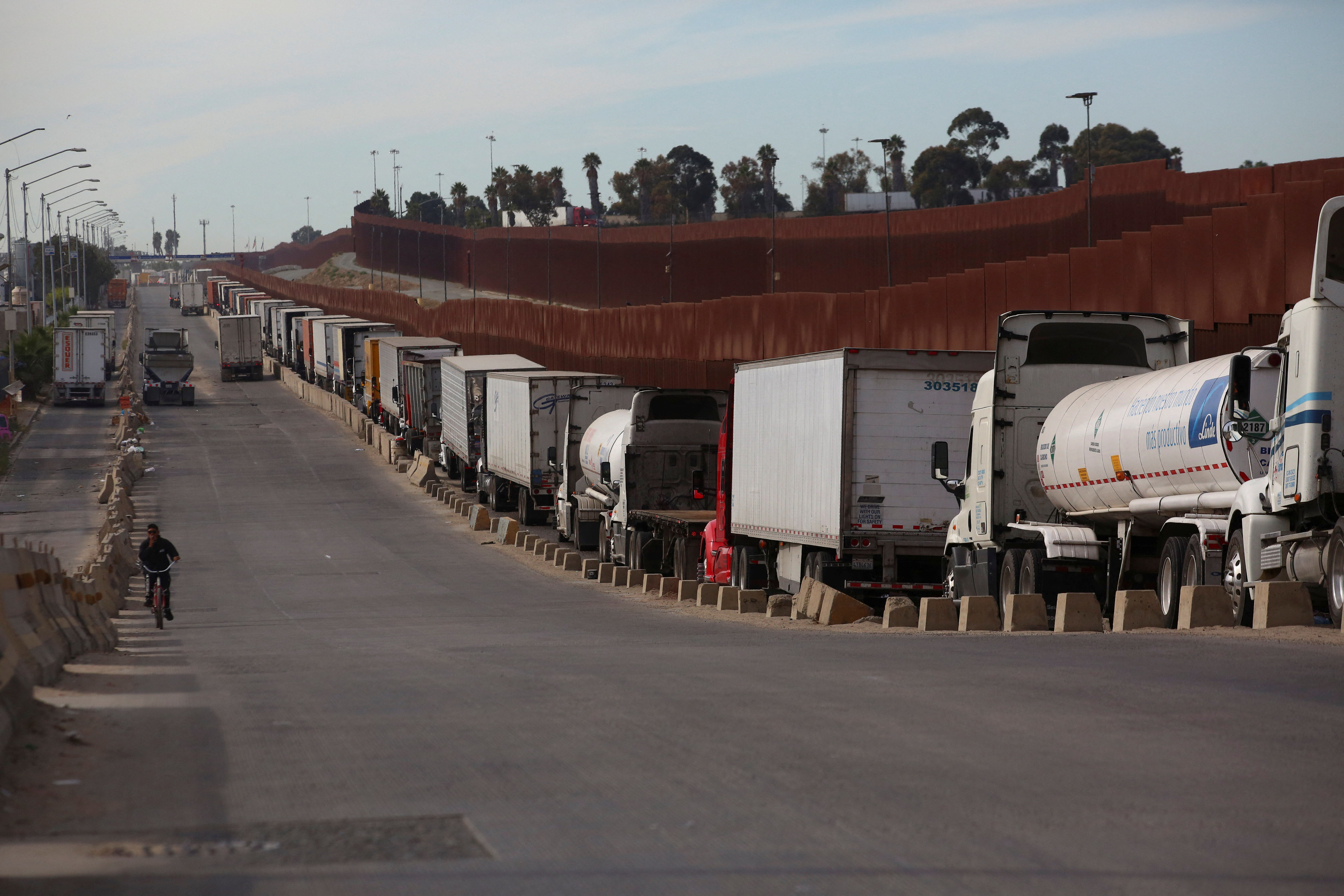 Trucks queue to cross into the United States at the Otay Mesa Port of Entry, in Tijuana