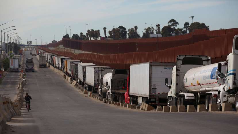 Trucks queue to cross into the United States at the Otay Mesa Port of Entry, in Tijuana
