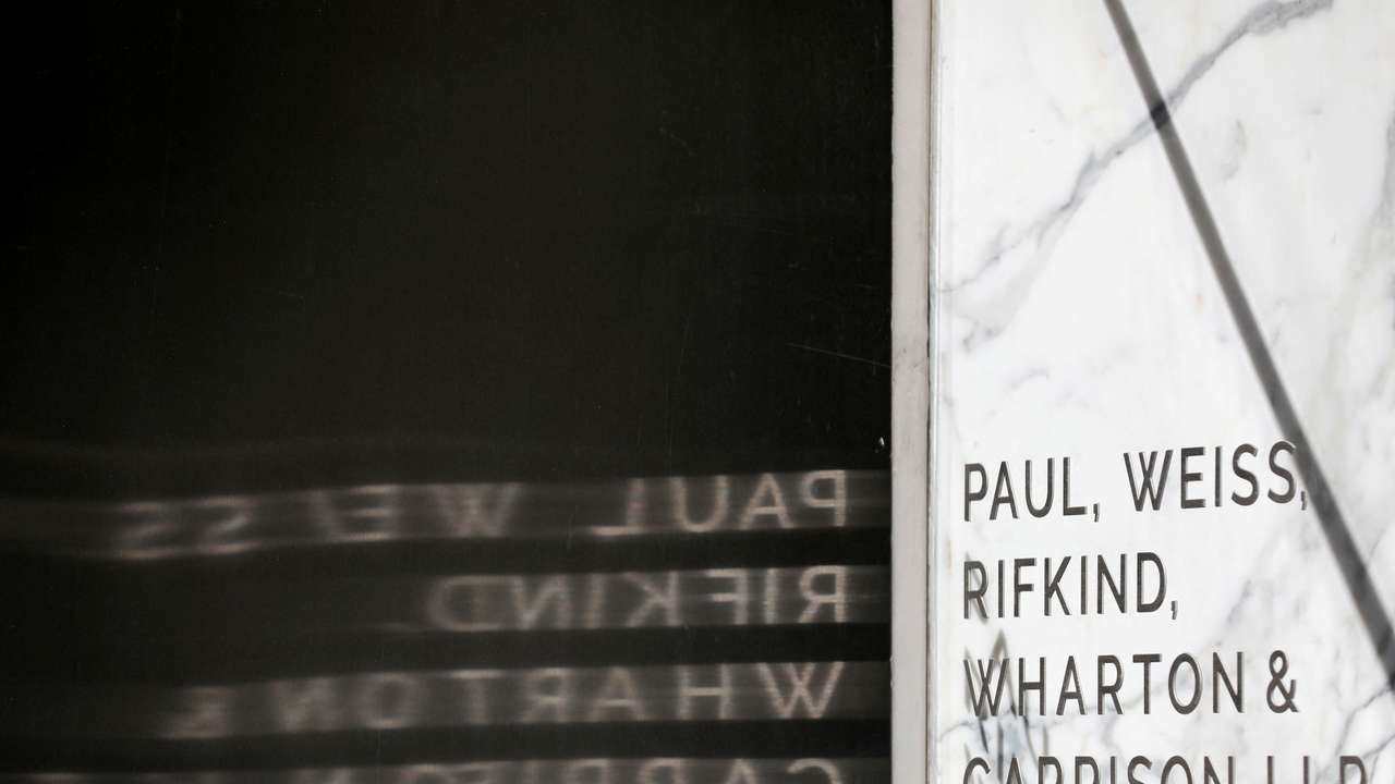 FILE PHOTO: Signage is seen outside of the law firm Paul, Weiss, Rifkind, Wharton & Garrison LLP in Washington, D.C.
