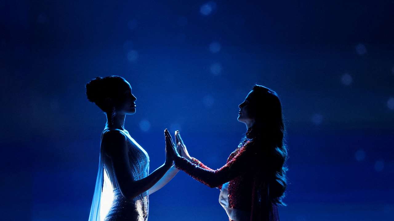 Praveenar Singh of Thailand and Fatima Bosch of Mexico hold hands as they wait for the announcement of the winner of the 74th Miss Universe pageant, in Bangkok, Thailand, November 21, 2025. REUTERS/Chalinee Thirasupa TPX IMAGES OF THE DAY