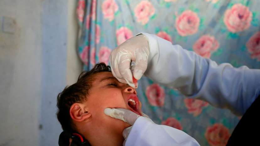 FILE PHOTO: Boy receives a polio vaccine during a three-day immunization campaign in Sanaa