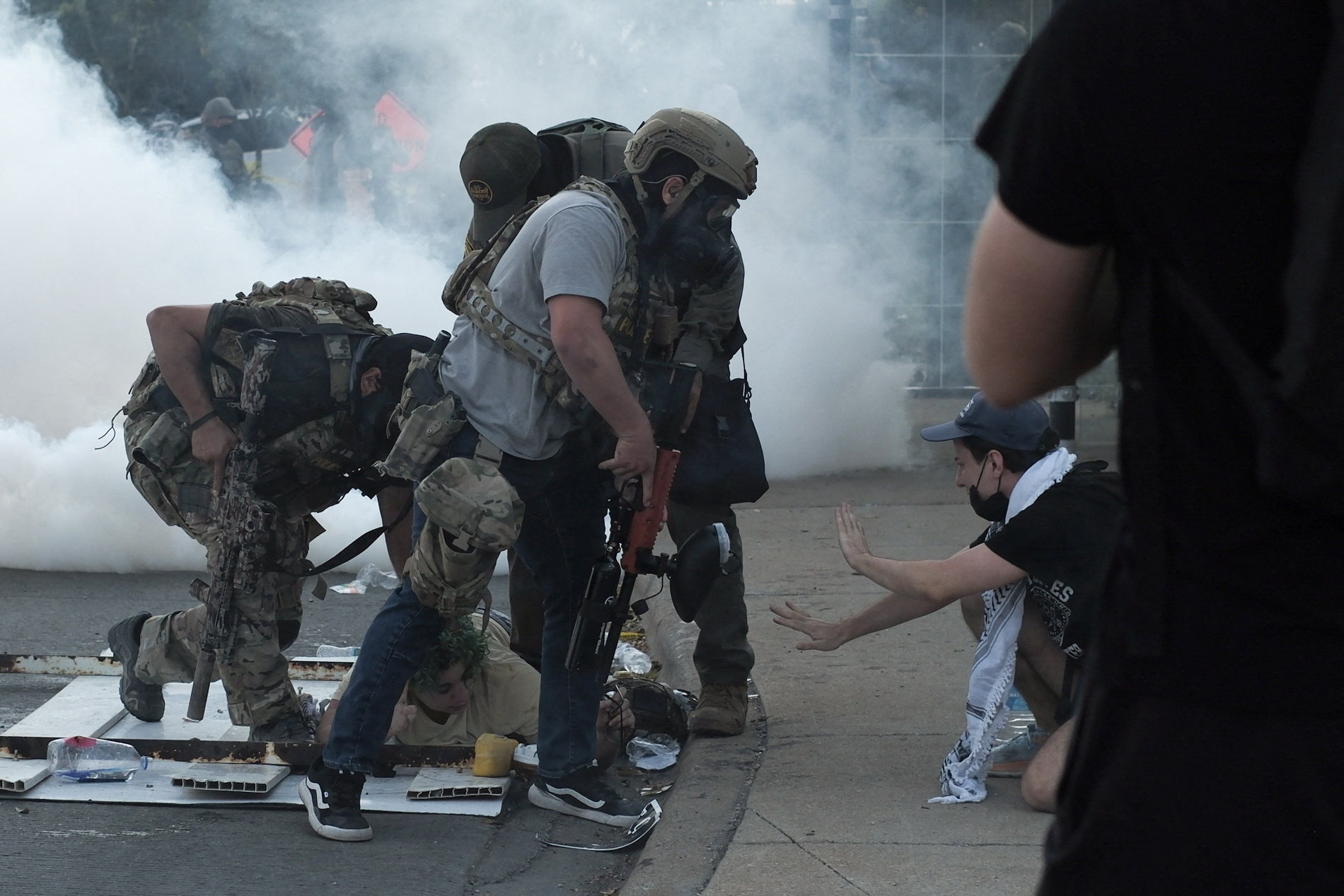 People protest during a standoff with ICE and federal officers in Chicago