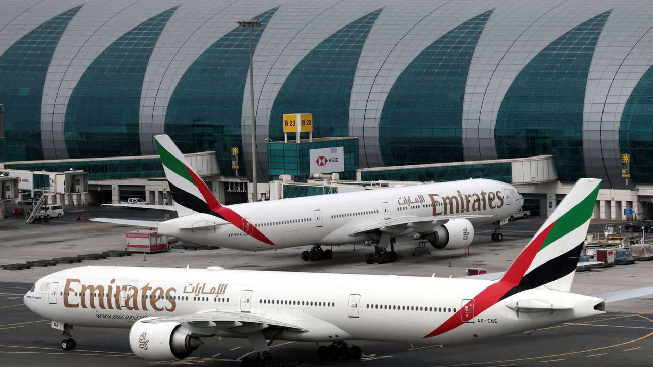 FILE PHOTO: Emirates Airline Boeing 777-300ER planes are seen at Dubai International Airport in the United Arab Emirates February 15, 2019. REUTERS/Christopher Pike/File Photo