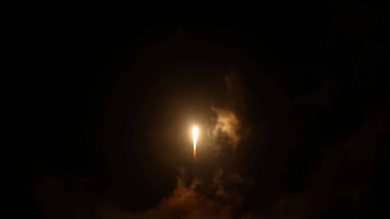A rocket flies in the sky, amid cross-border hostilities between Hezbollah and Israel, in central Israel