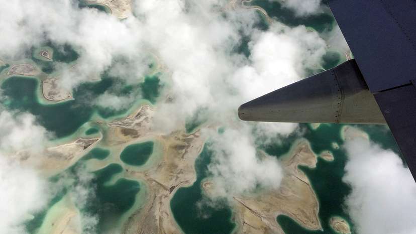 FILE PHOTO: Lagoons can be seen from a plane as it flies above Kiritimati Island, part of the Pacific Island nation of Kiribati