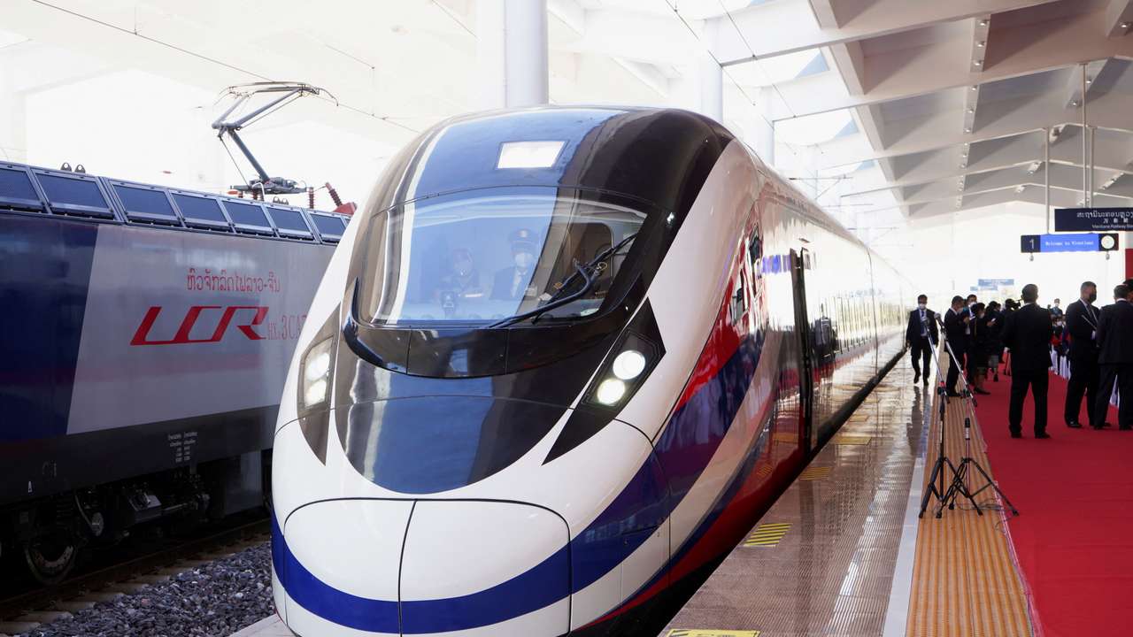 FILE PHOTO: A train is ready on the station during the handover ceremony of the high-speed rail project linking the Chinese southwestern city of Kunming with Vientiane in Laos