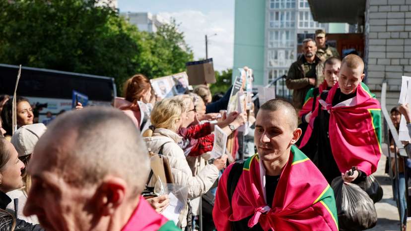 Freed Ukrainian POWs return after a swap, in an undisclosed location in Ukraine