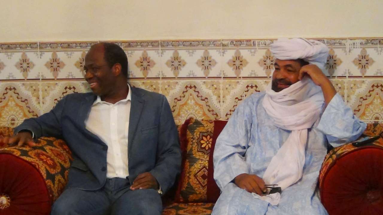 FILE PHOTO: Iyad Ag Ghali, the leader of Ansar Dine, an al Qaeda-linked Islamist group in northern Mali, meets with Burkina Faso foreign minister Djibril Bassole in Kidal, northern Mali