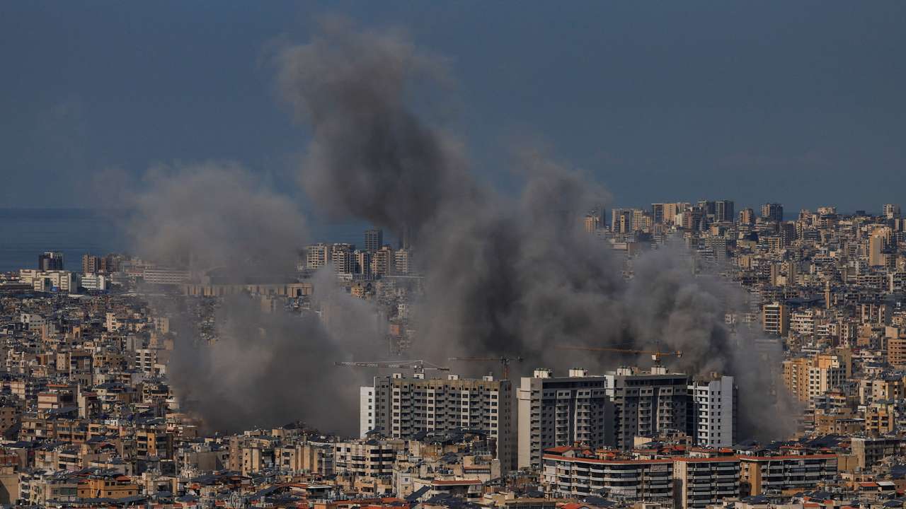 Smoke billows after reported strikes on Beirut’s southern suburbs, as seen from Baabda