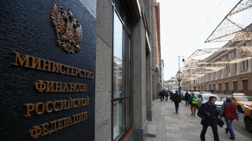 Pedestrians walk past Russia's Finance Ministry building in Moscow