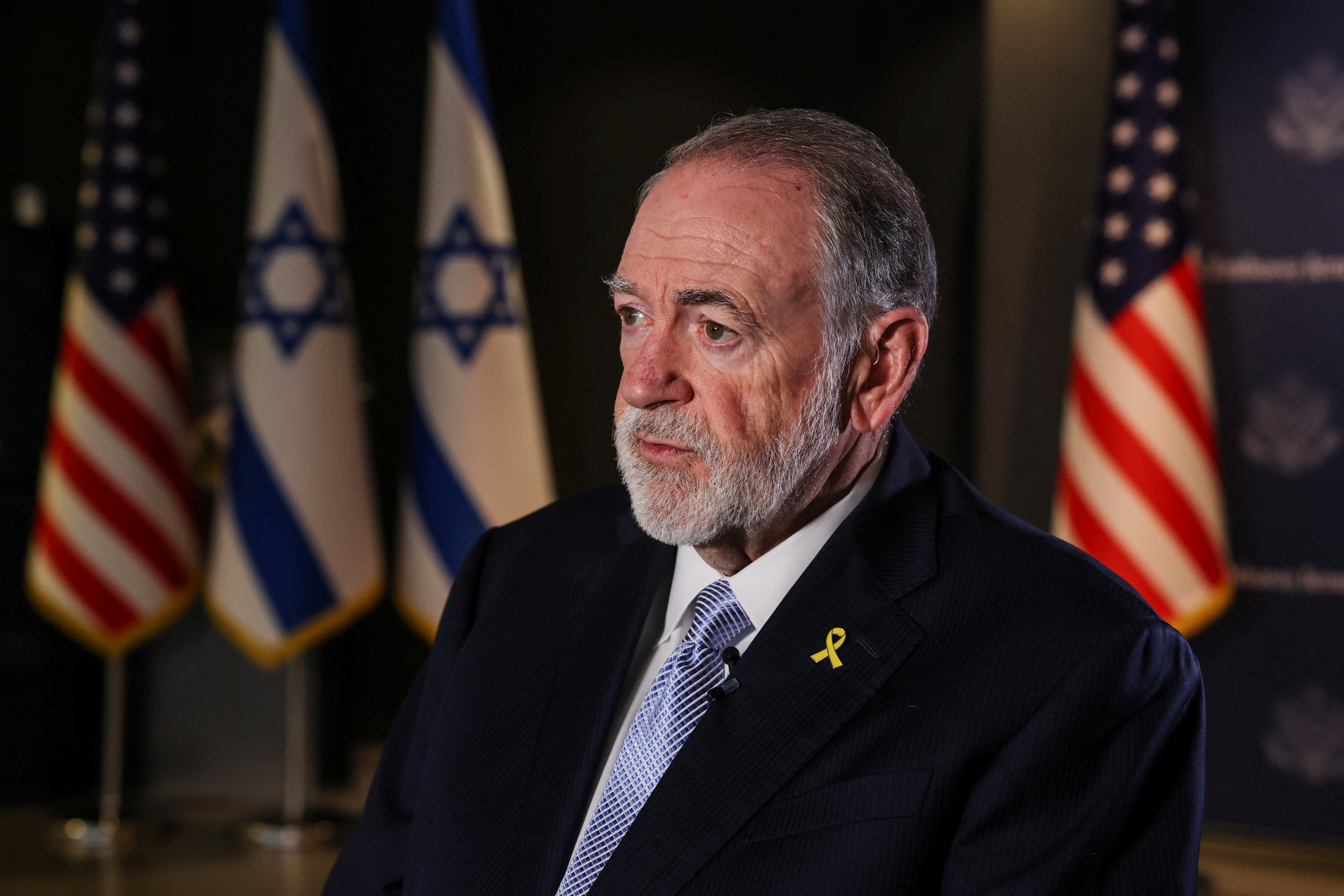 U.S. Ambassador to Israel Mike Huckabee looks on during an interview with Reuters in Jerusalem