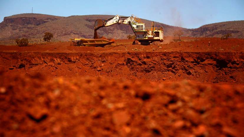 File picture of a giant excavator loading a mining truck at the Fortescue Solomon iron ore mine south of Port Hedland