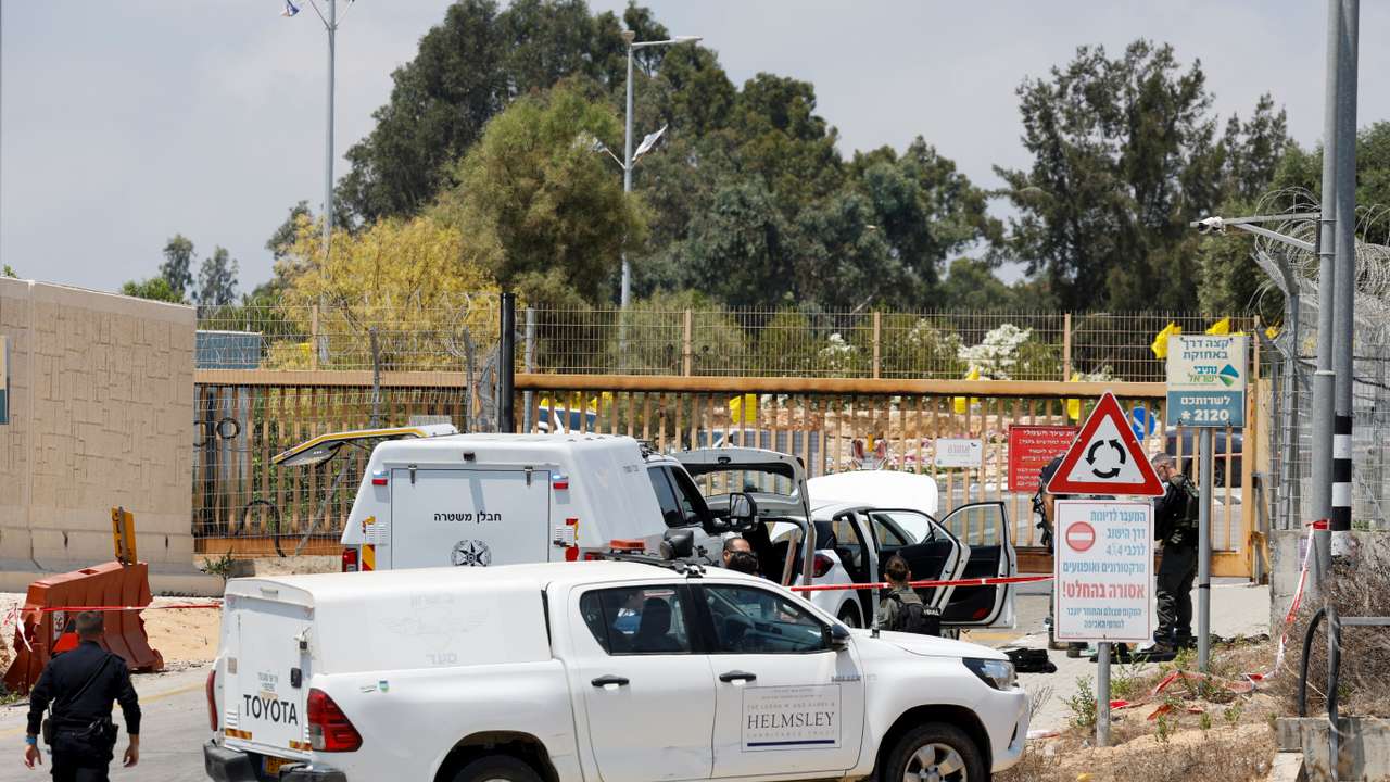 Israeli officials work at the scene of an attempted stabbing attack, in Netiv Haasara
