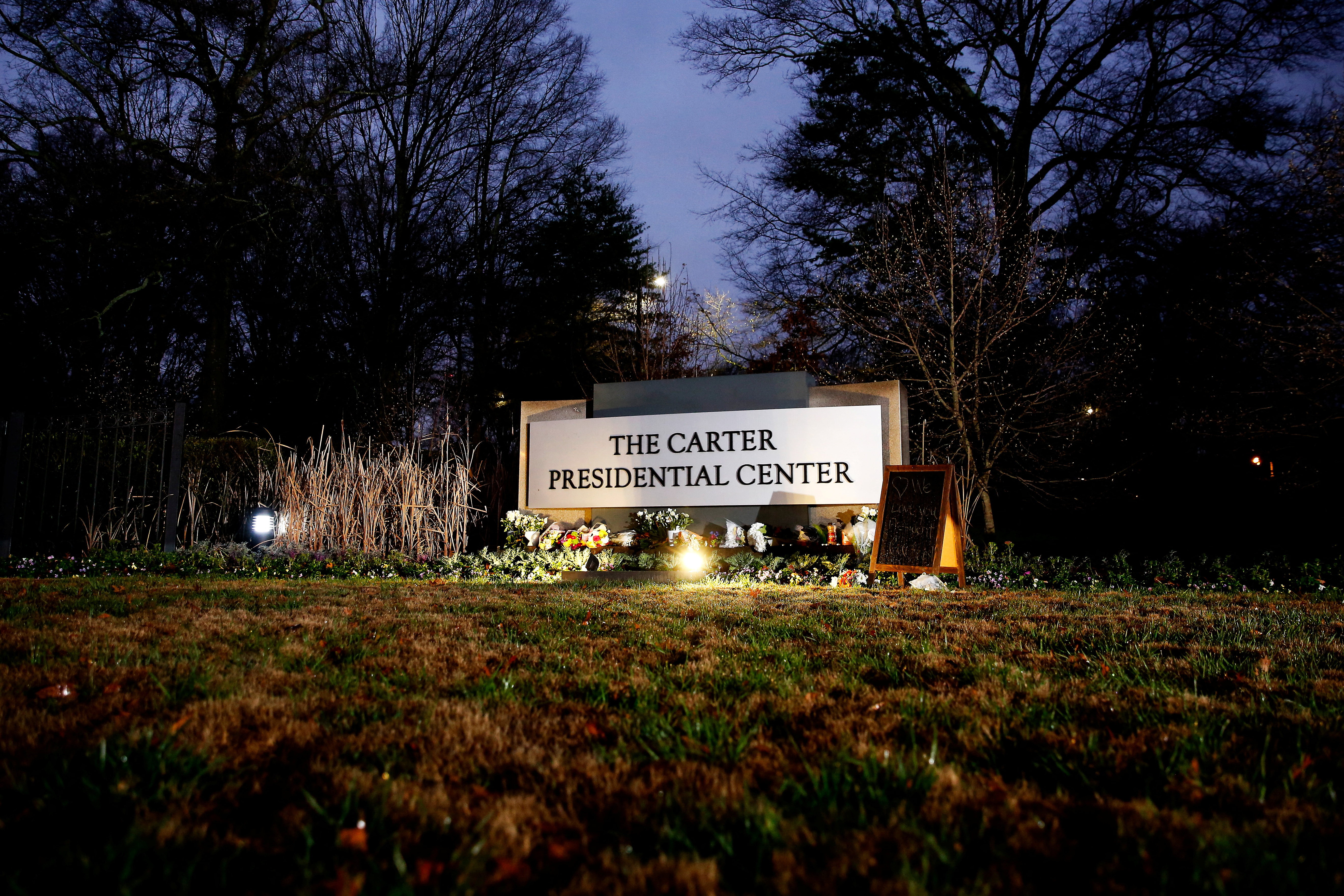 People pay tribute to former U.S. President Jimmy Carter who passed away at the age of 100