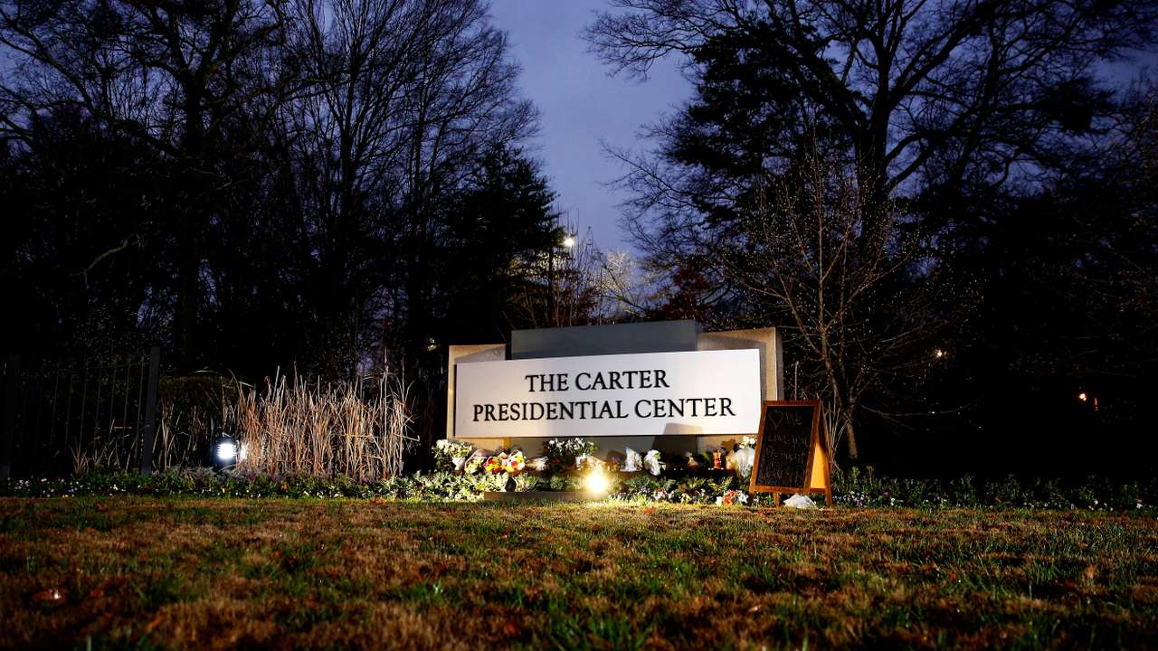 People pay tribute to former U.S. President Jimmy Carter who passed away at the age of 100