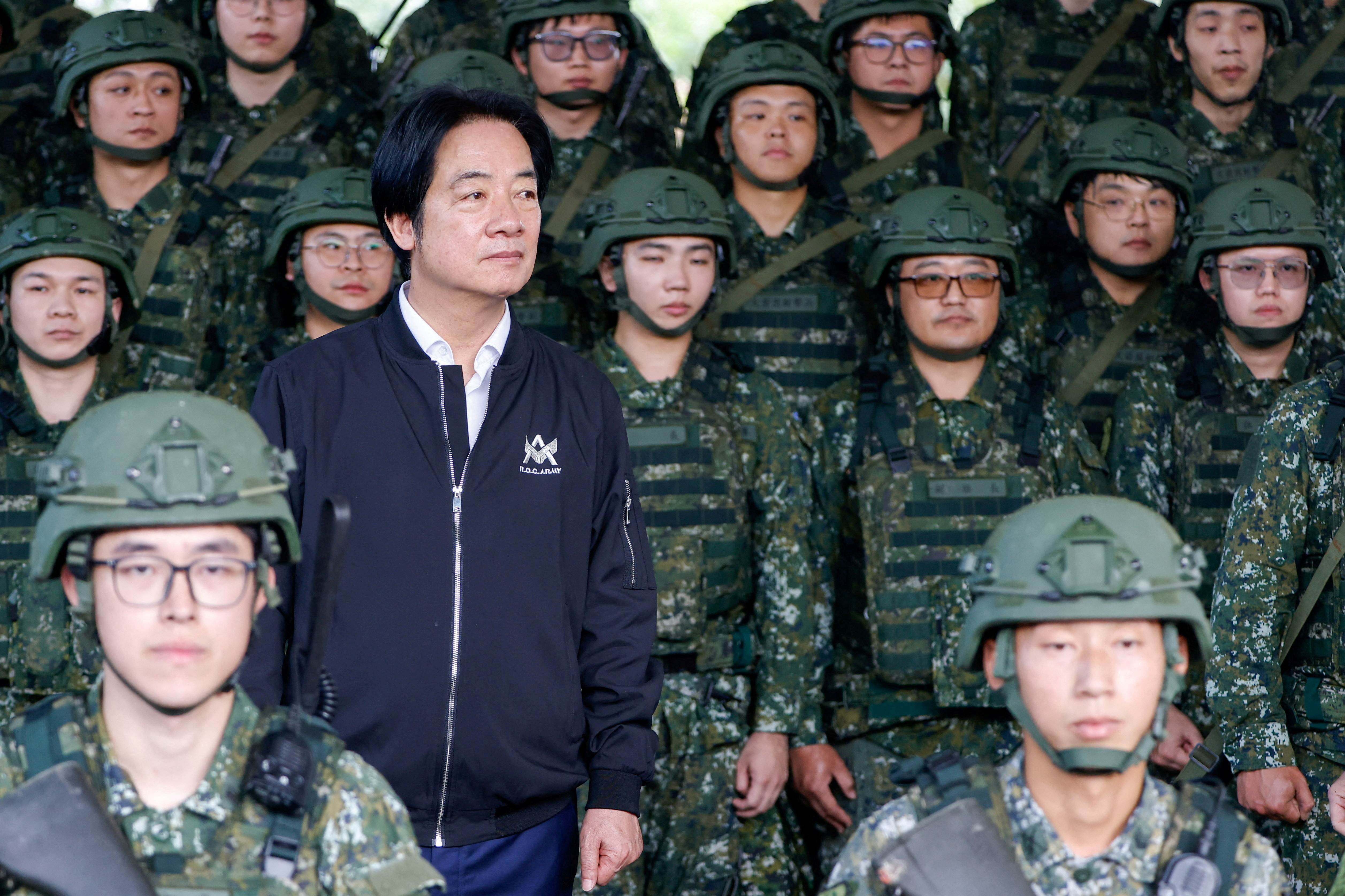 FILE PHOTO: Taiwan President Lai Ching-te poses for photo after inspecting reservists operating a Taiwan made Hummer 2 Drone during a training session at Loung Te Industrial Parks Service Center in Yilan