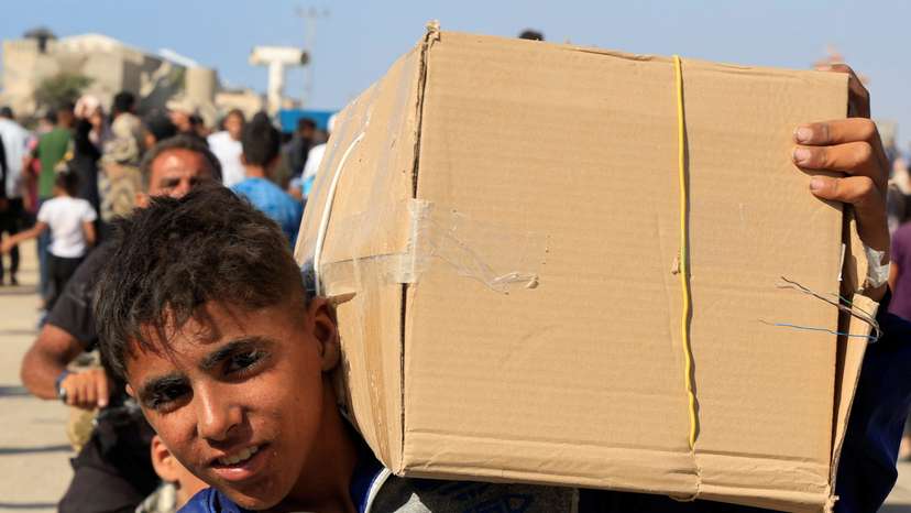 Palestinians seeking aid gather near an aid distribution site run by the U.S.-backed Gaza Humanitarian Foundation, in Rafah