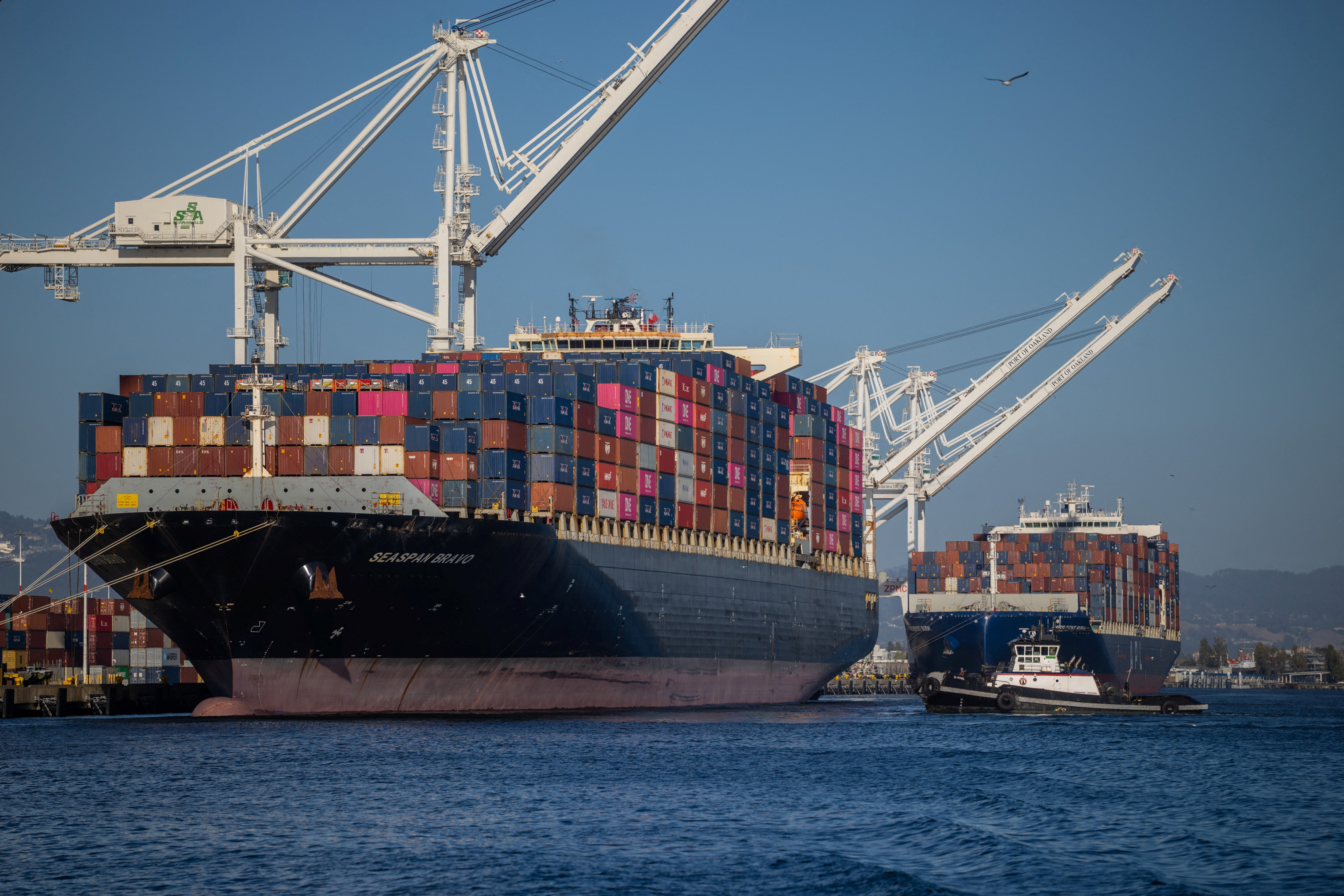 A cargo ship full of shipping containers is seen at the port of Oakland, California