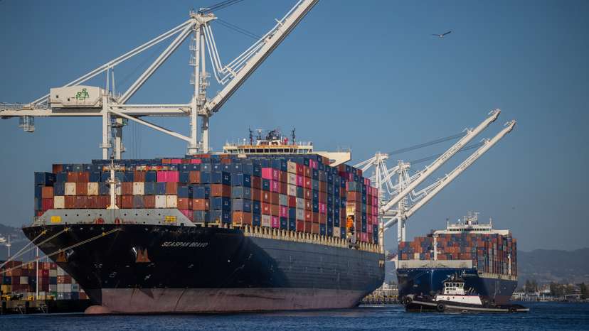 A cargo ship full of shipping containers is seen at the port of Oakland, California