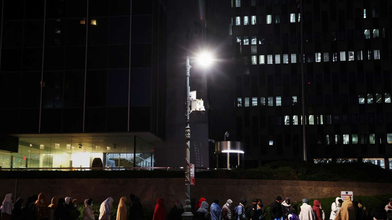 Immigrants wait in line outside the Federal Plaza Immigration Court in New York City