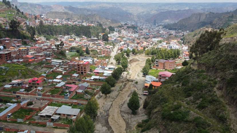 River flooding due to rain affects homes, in La Paz