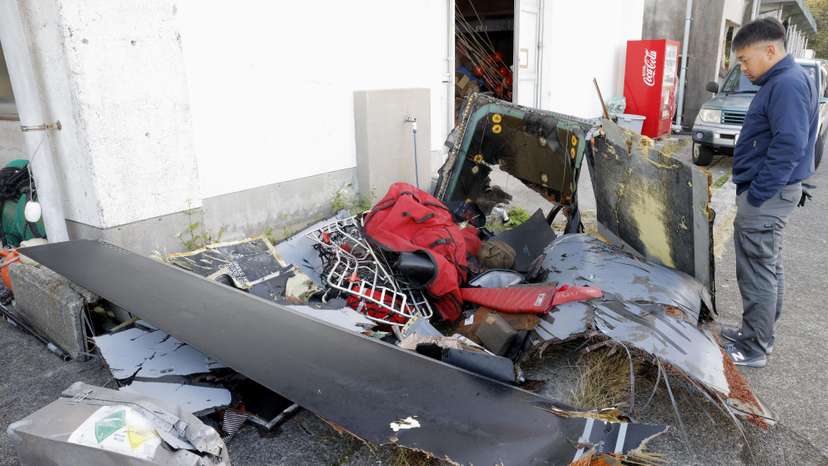 Wreckage believed to belong to the U.S. military aircraft V-22 Osprey that crashed into the sea is collected at Anbo port at Yakushima Island