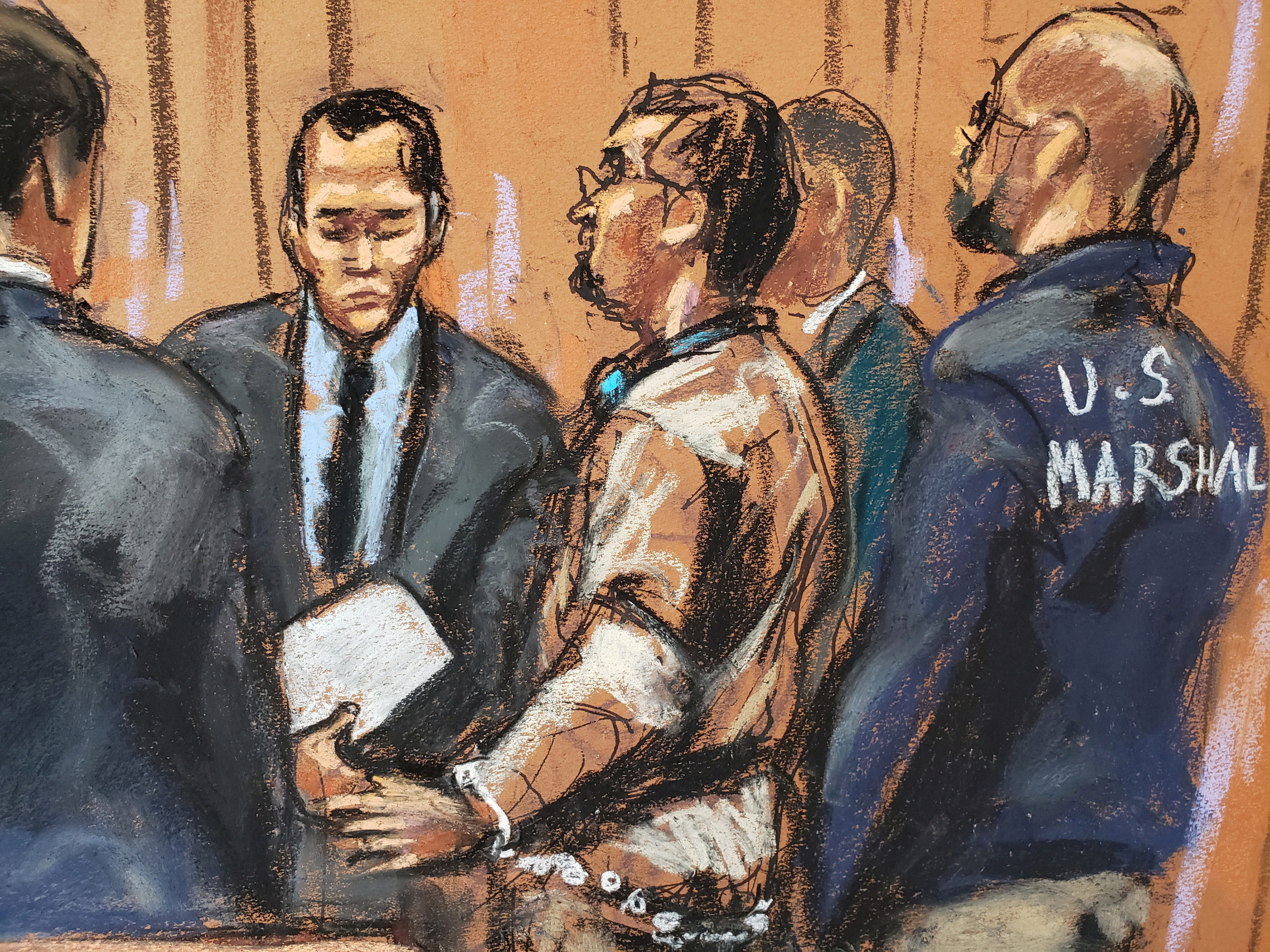 Former Honduran President Juan Orlando Hernandez sits during a court hearing in New York