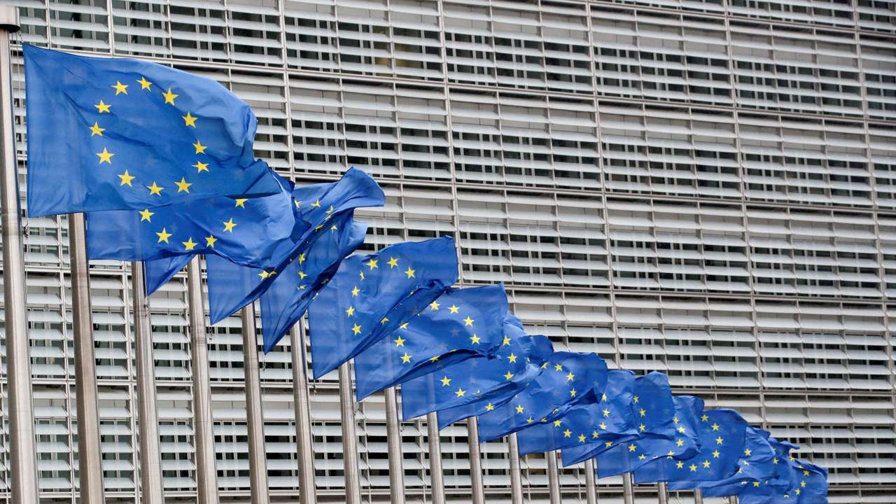 FILE PHOTO: Flags flutter outside EU Commission in Brussels