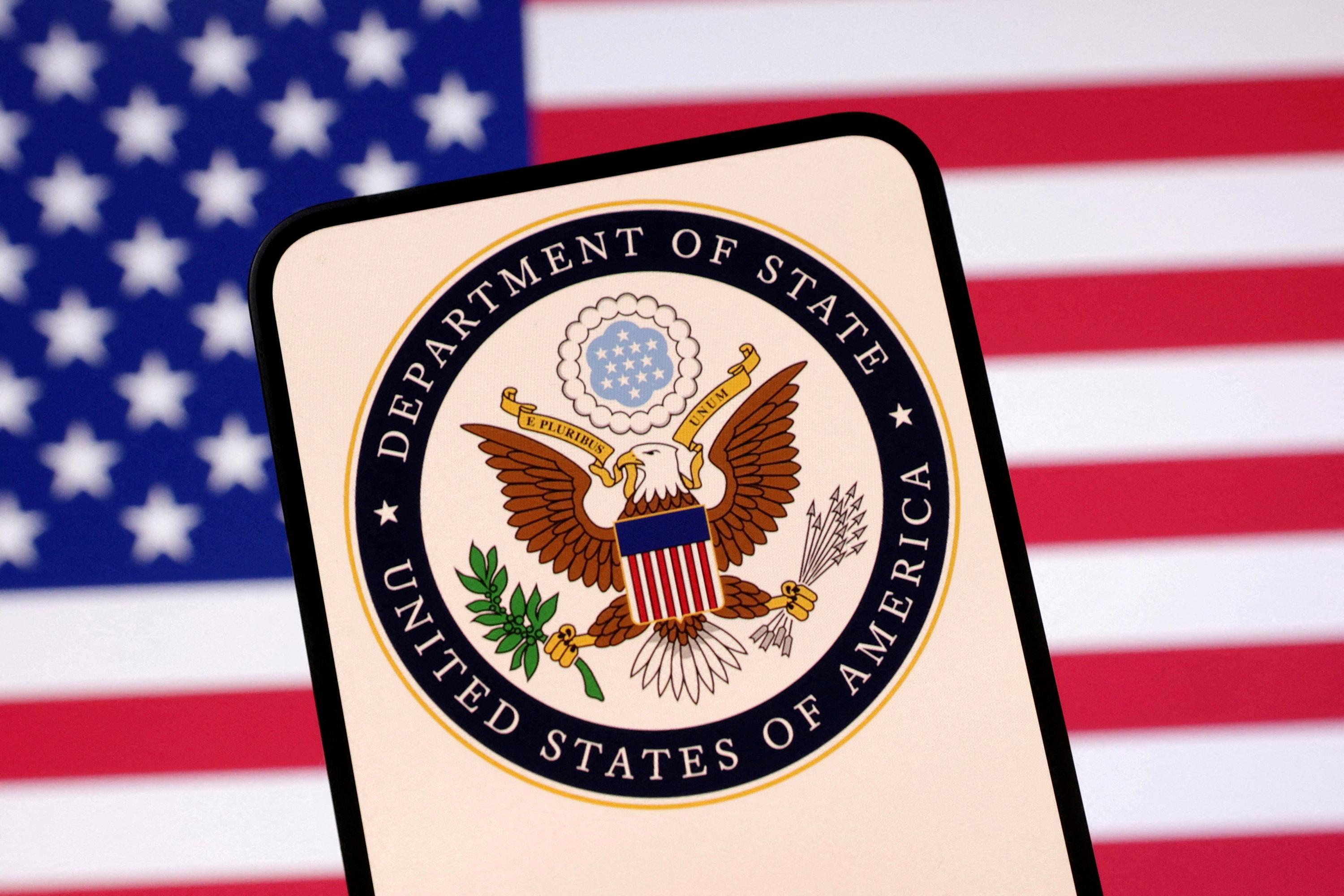 FILE PHOTO: Illustration shows United States Department of State logo and U.S. flag